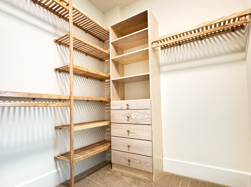 Custom hardwood reach-in closet with drawers by Sun Closets